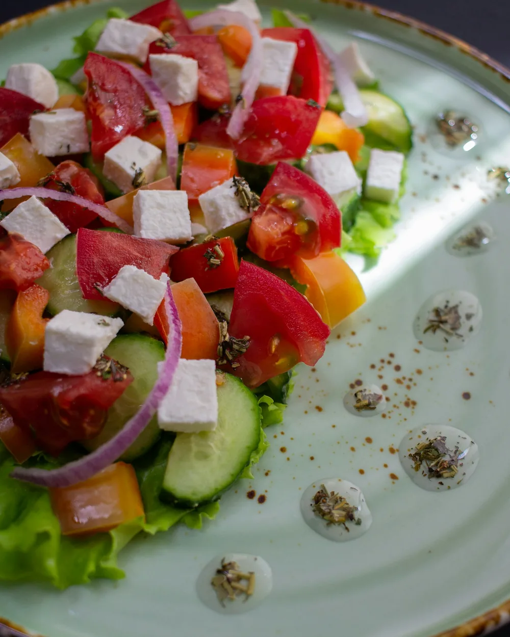 Sample photo: a Greek salad with feta and olives, seen from above