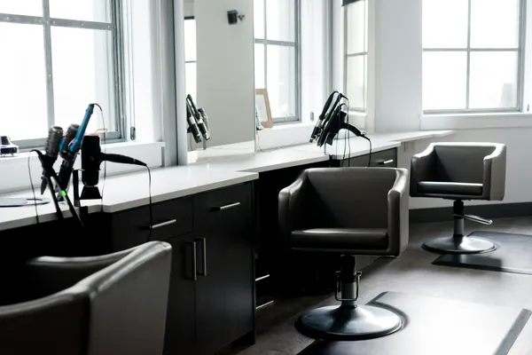 Salon styling stations by bright windows