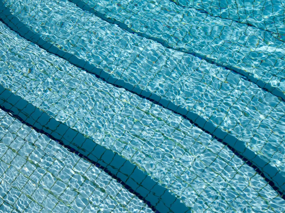The edge of a pool in the early morning.